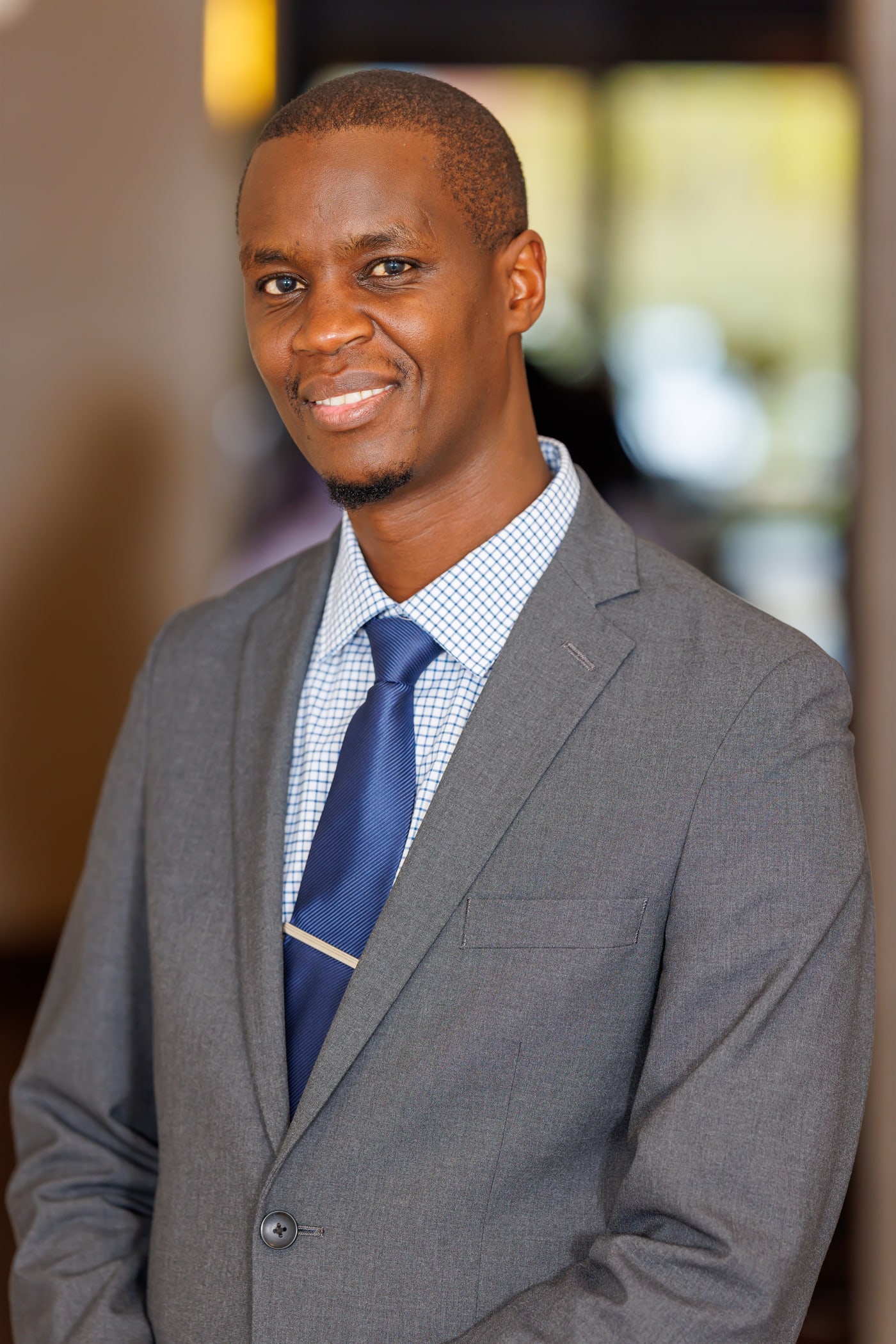 Professional close portrait in suit and tie.