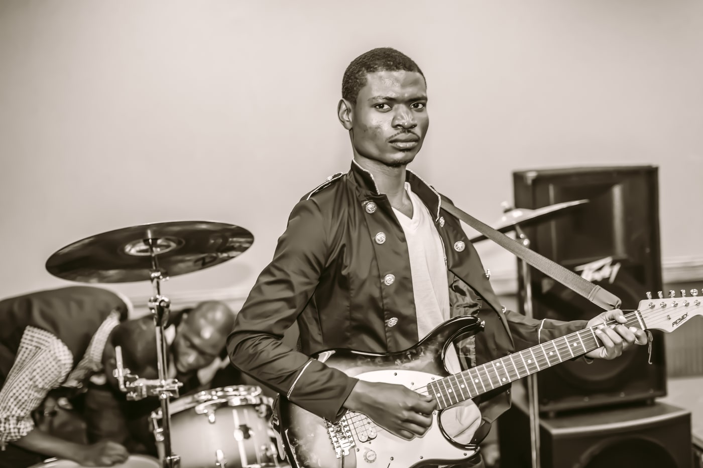 Music portrait with guitar and studio-documentary feel.