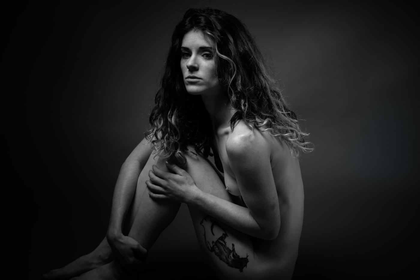 B&W artistic bare-shoulder figure, moody (APPROVAL: fine-art).
