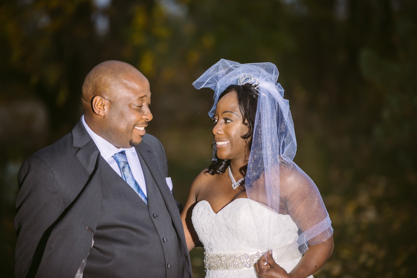 Wedding couple portrait with warm evening light and clear emotion.